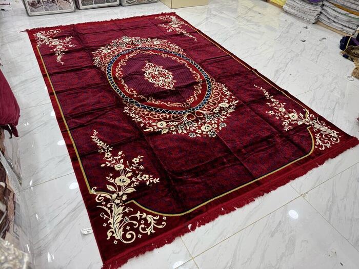 Traditional red medallion woven rug with floral border