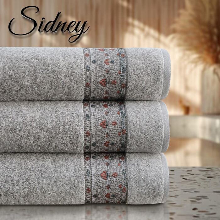 Sidney brand grey towels stacked with floral patterned border